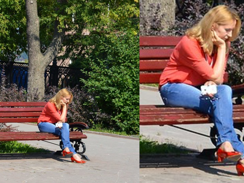 Frau sitzt etwas traurig und einsam auf einer Parkbank