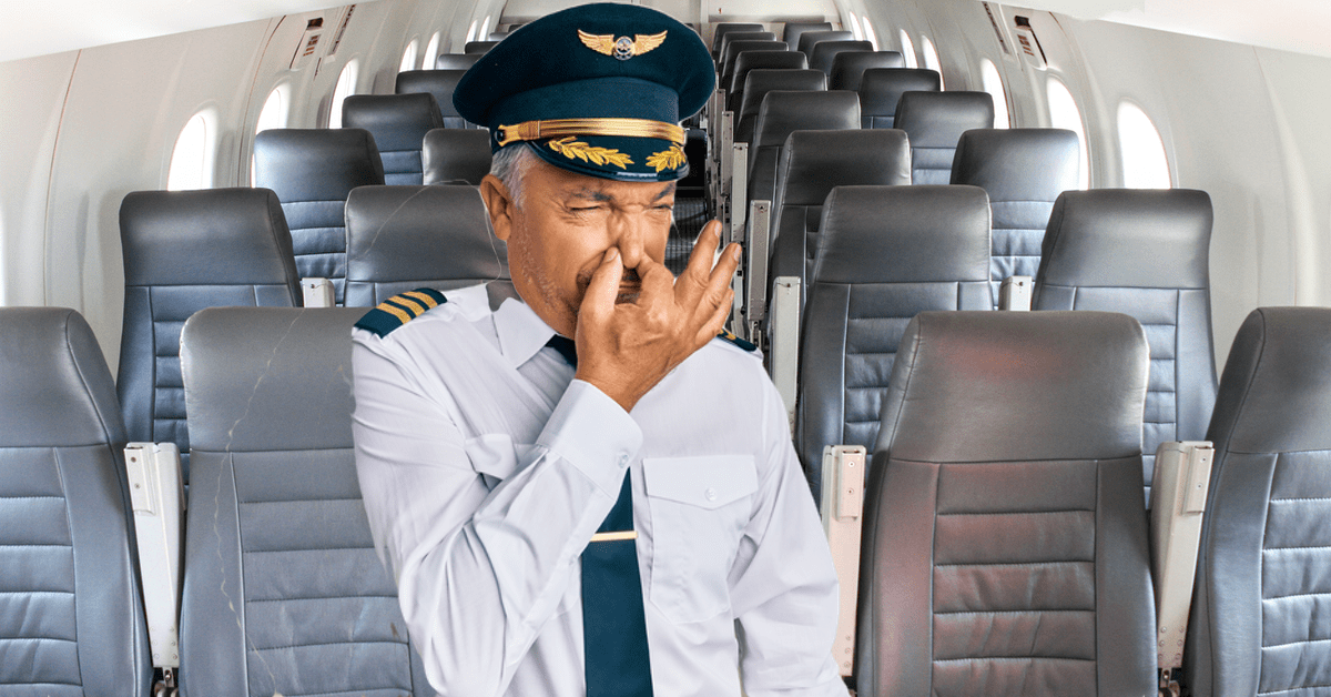 Pilot in einem Flugzeug hÃ¤lt sich vor Gestank die Nase zu